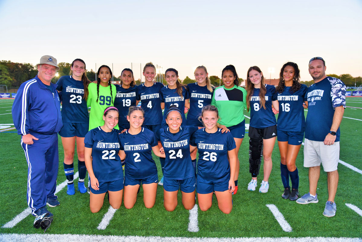 The Huntington girls' soccer seniors with coaches John Walsh and Vincent Tannazzo 