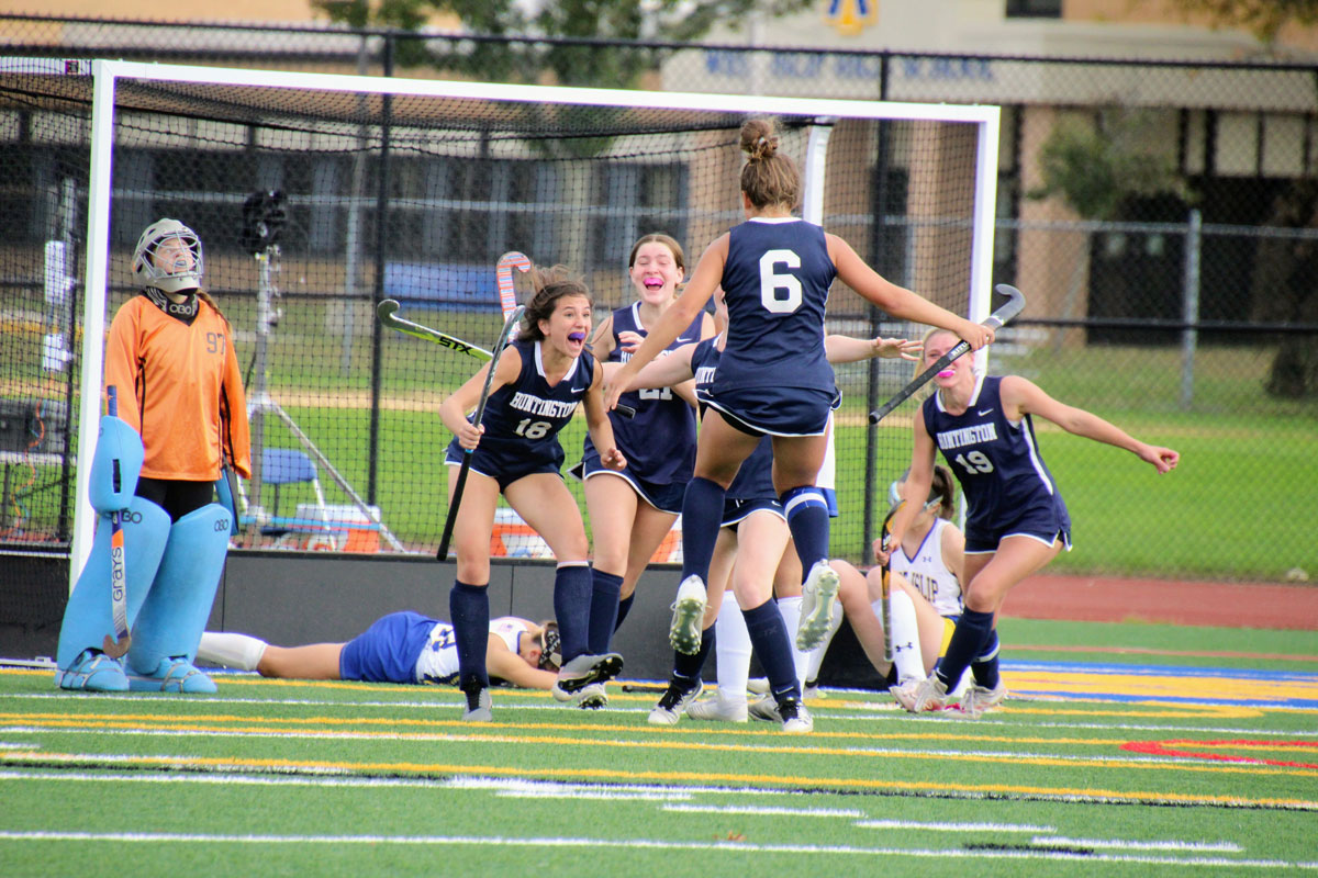 Tessie Maerz (No. 18), Laurel Bonn (No. 6) and their teammates celebrate. (Stacey Byrnes photos.)