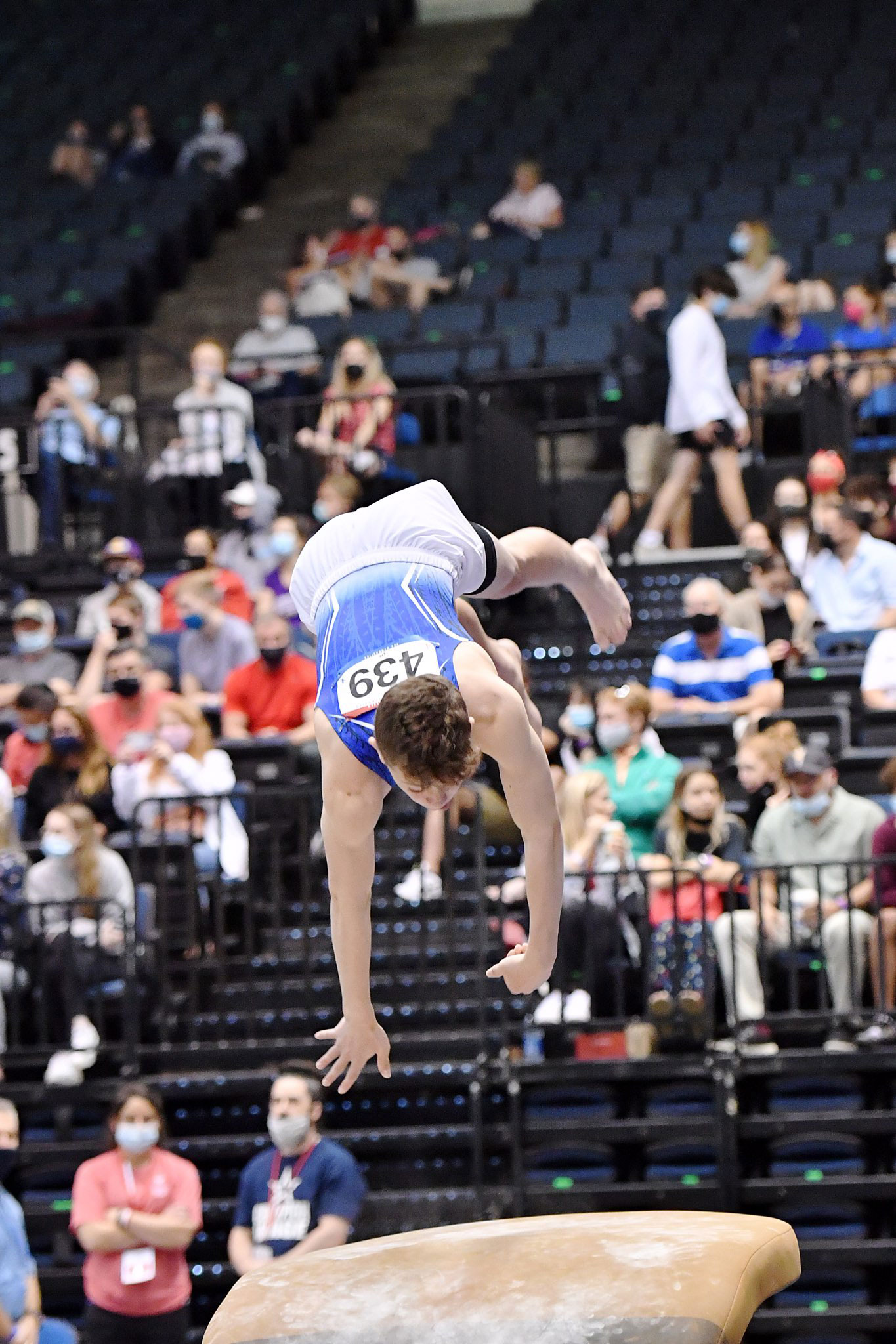  Sam Cirlincione flies through the air at a gymnastics invitational. 