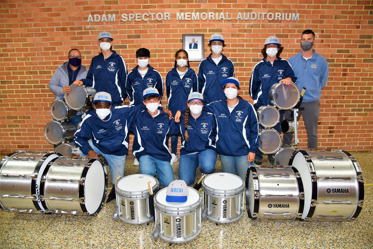 Blue Devil marching band drumline members and their advisors after the exhibition for the Board of Education 