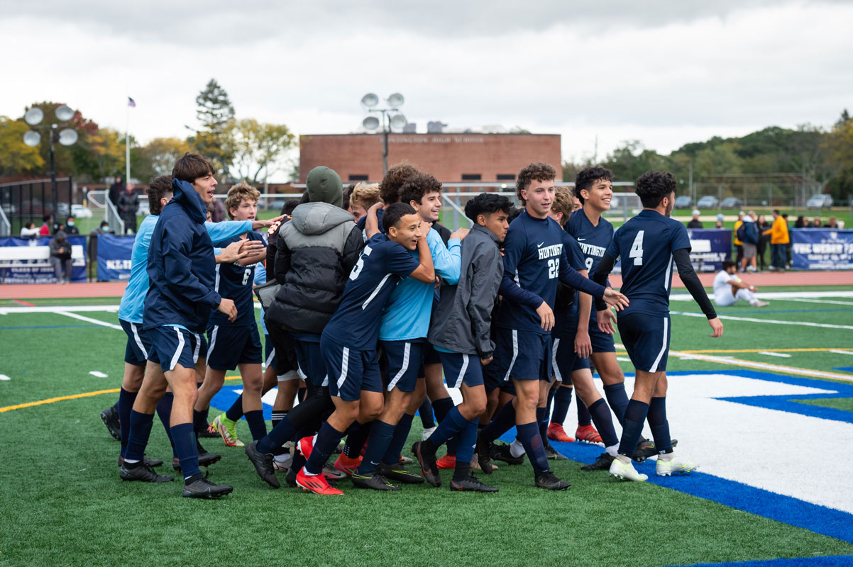 The Blue Devils coulnd't be happier to advance to the county quarterfinals. (Darin Reed photo.)