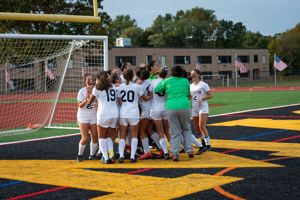 The Blue Devils celebrate their upset playoff victory. (Darin Reed photo.)