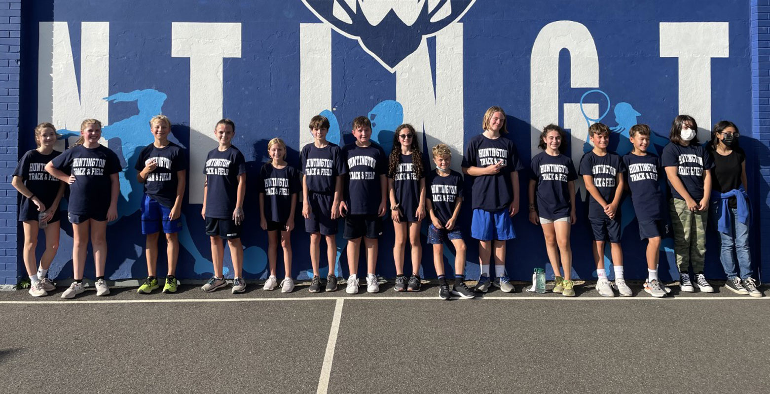 Finley Middle School cross-country team members behind the building last Friday afternoon.  