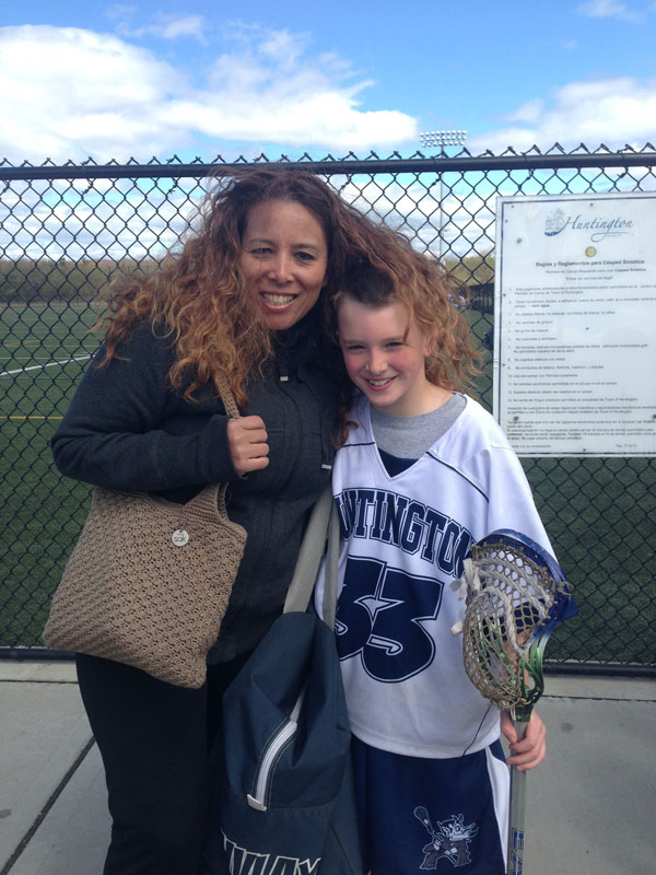  Huntington teacher Soraya Triessl with a fourth grade Christopher Maichin at his lacrosse game. 