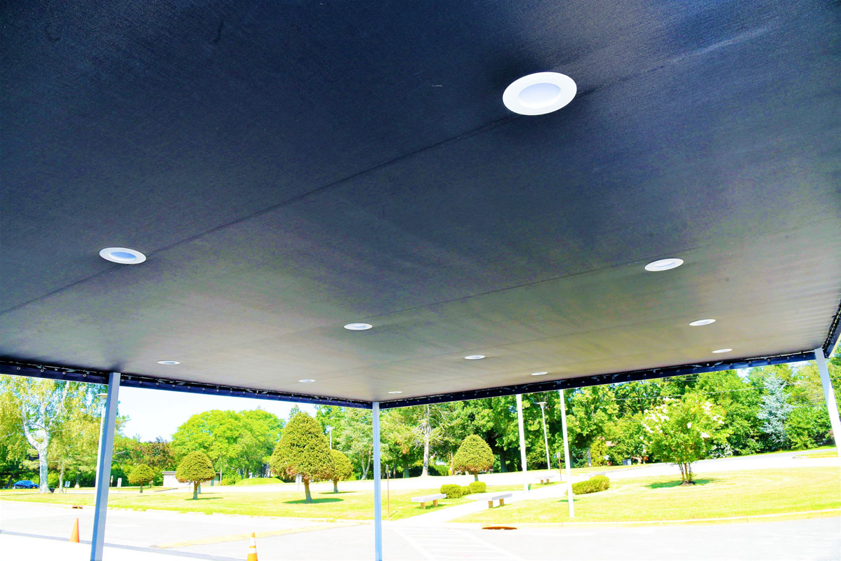 There is recessed lighting beneath each of the canopies.