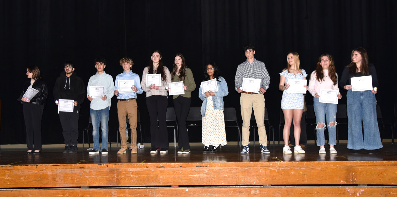 The new Social Studies Honor Society members on stage in the high school auditorium 