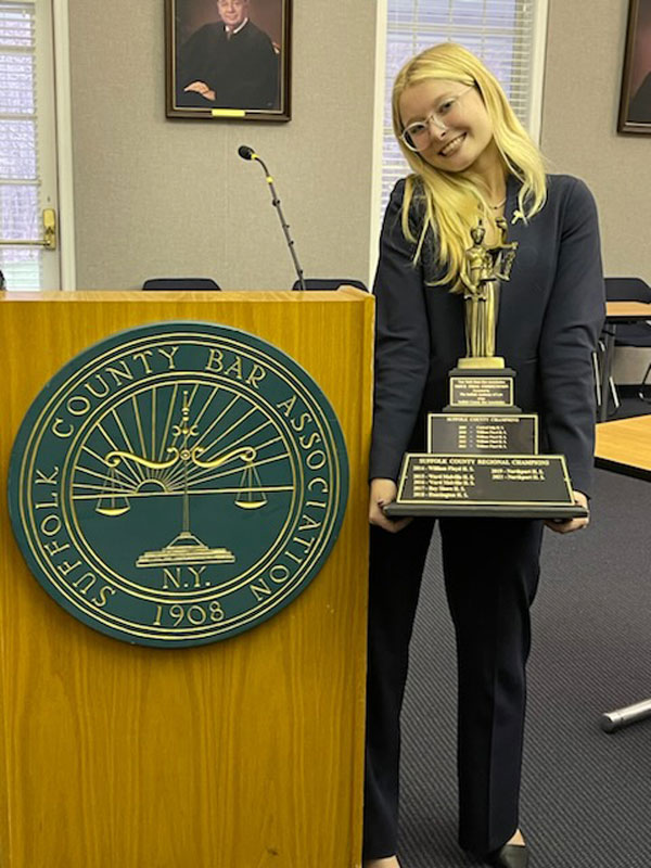 Emily Geller with the county championship trophy.