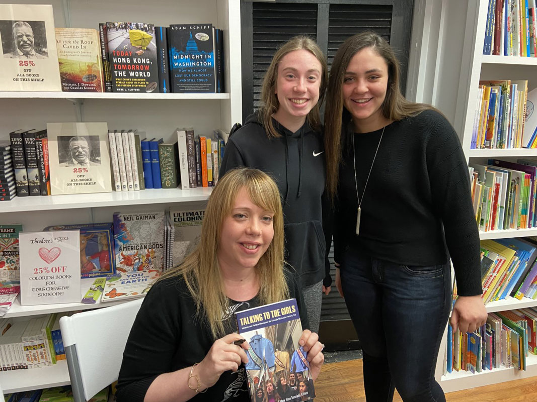 Finley teacher Kim Schiller with former students Megan Donaghy and Haileigh Smith.