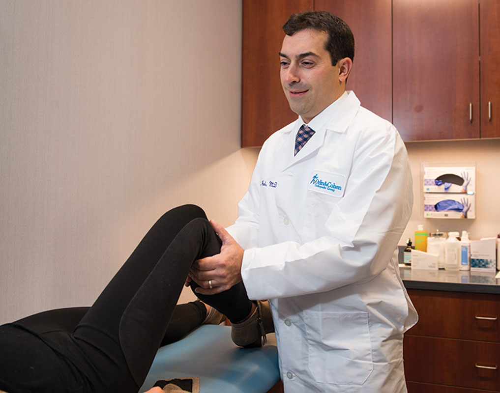 Dr. James Paci provides care to a patient