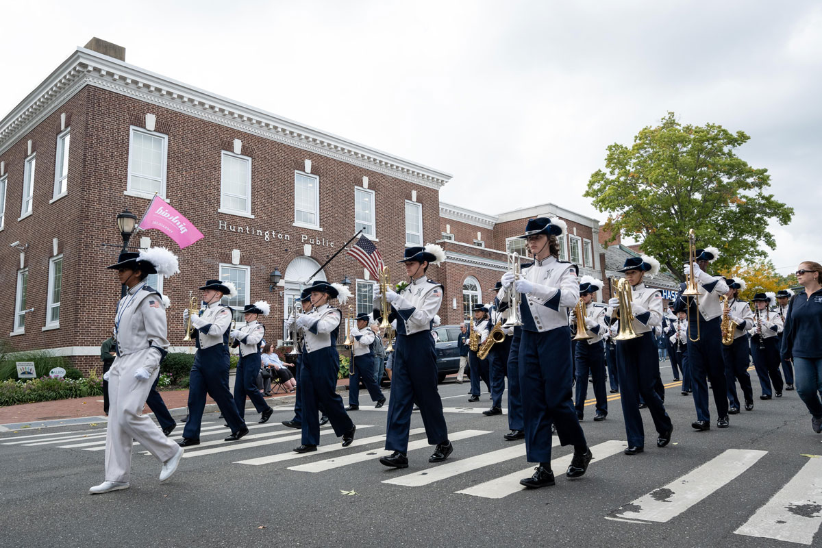 The Huntington Blue Devil marching band parades down Main Street. (Darin Reed photo.)