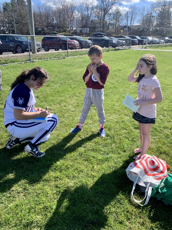Katie Barba signs autographs for Hunter Schmale and Madeline Leiter.