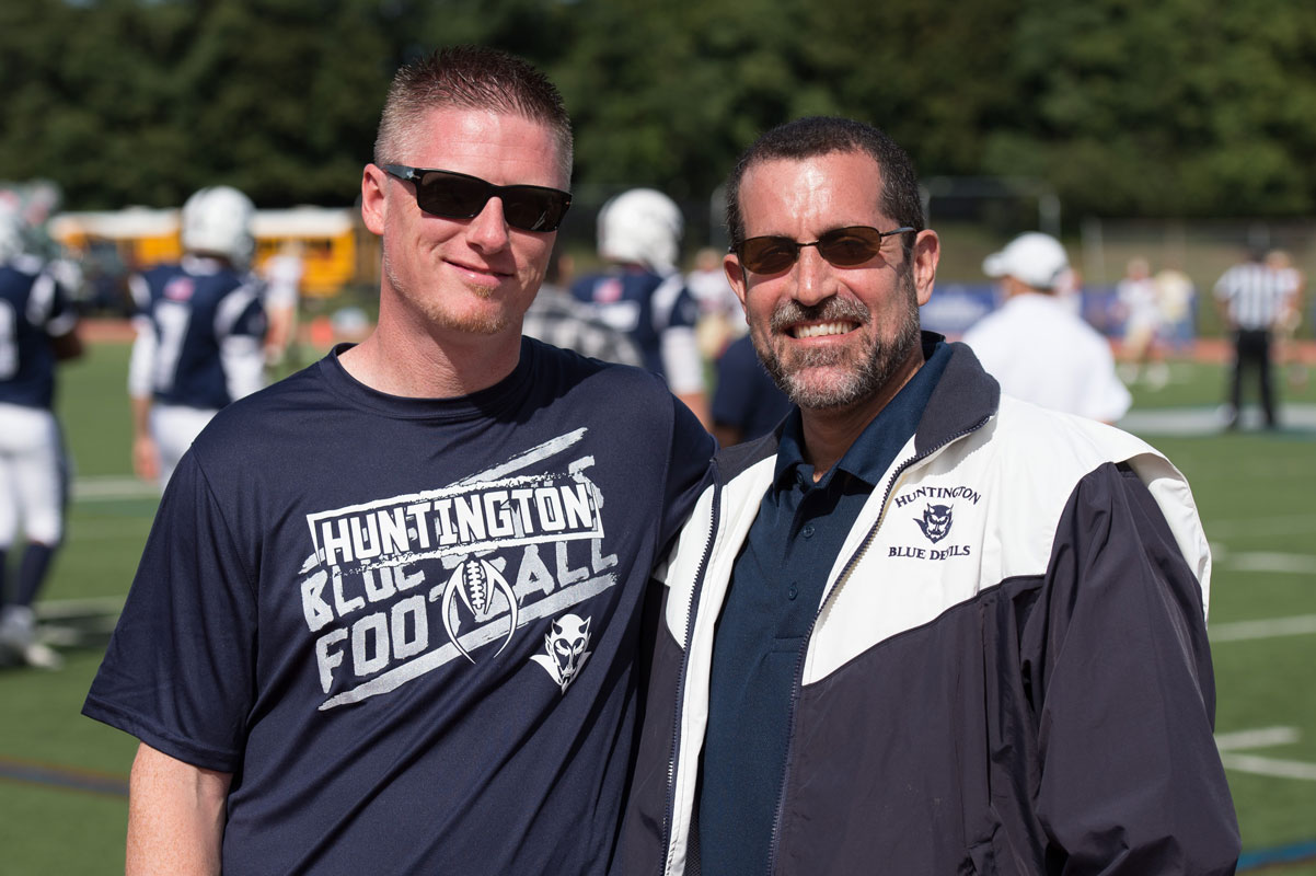 Principal Brenden Cusack and Superintendent Jim Polansky on the football sidelines. (Darin Reed photo.)