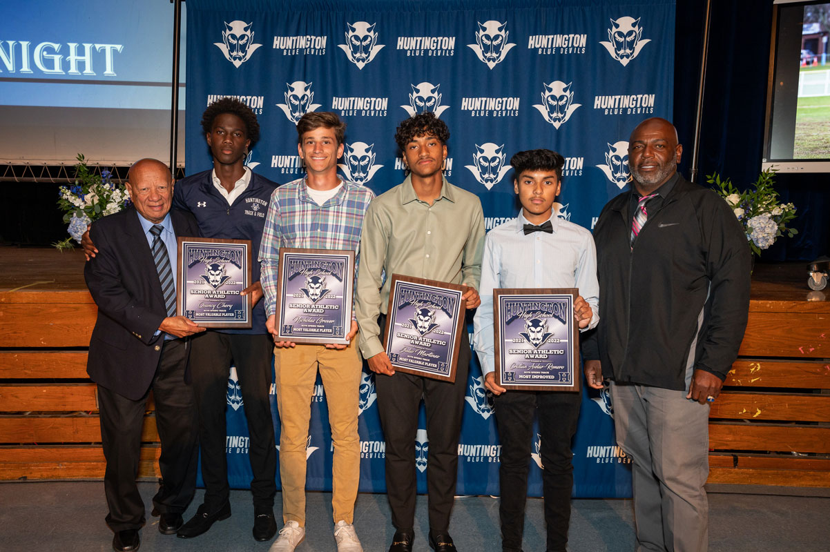 Huntington boys' track coaches with top spring track seniors. (Darin Reed photo)