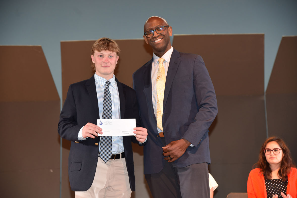 Gamal Smith presented Harrison Krywak with the October Dawn Scholarship 