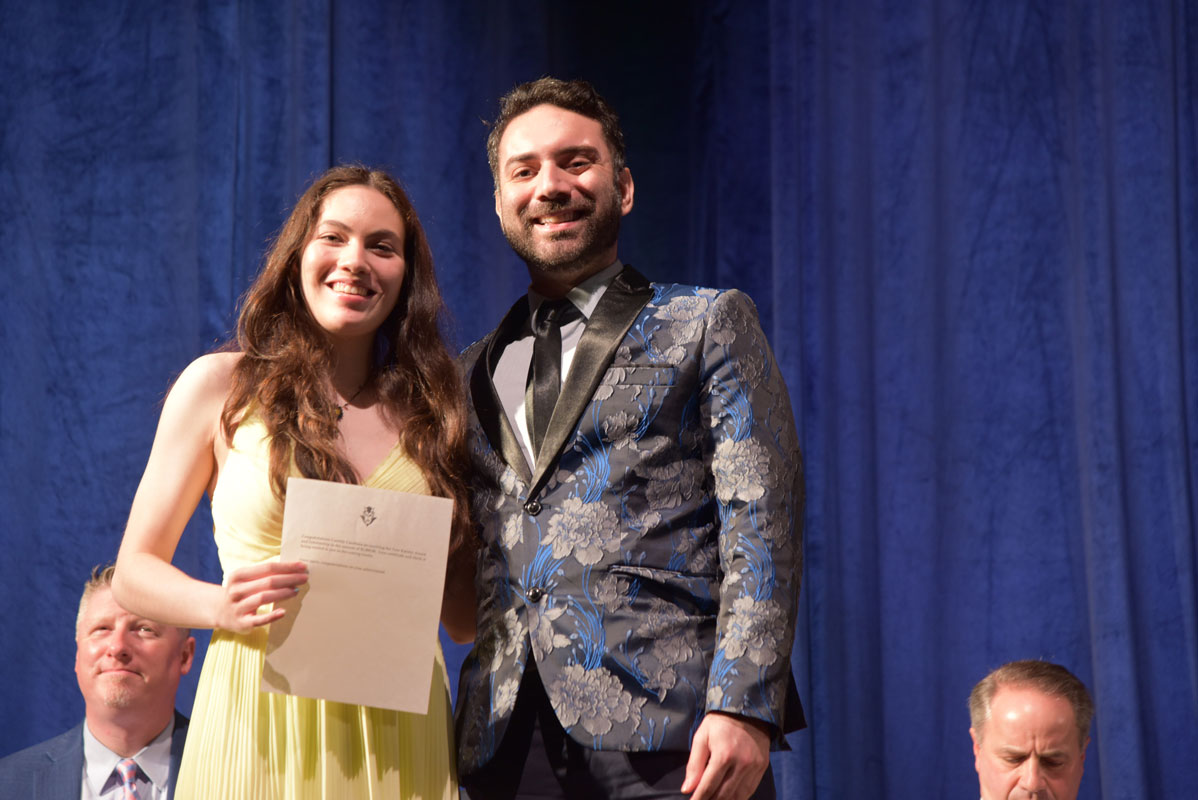 Cassidy Casabona with Huntington orchestra director James DiMeglio 