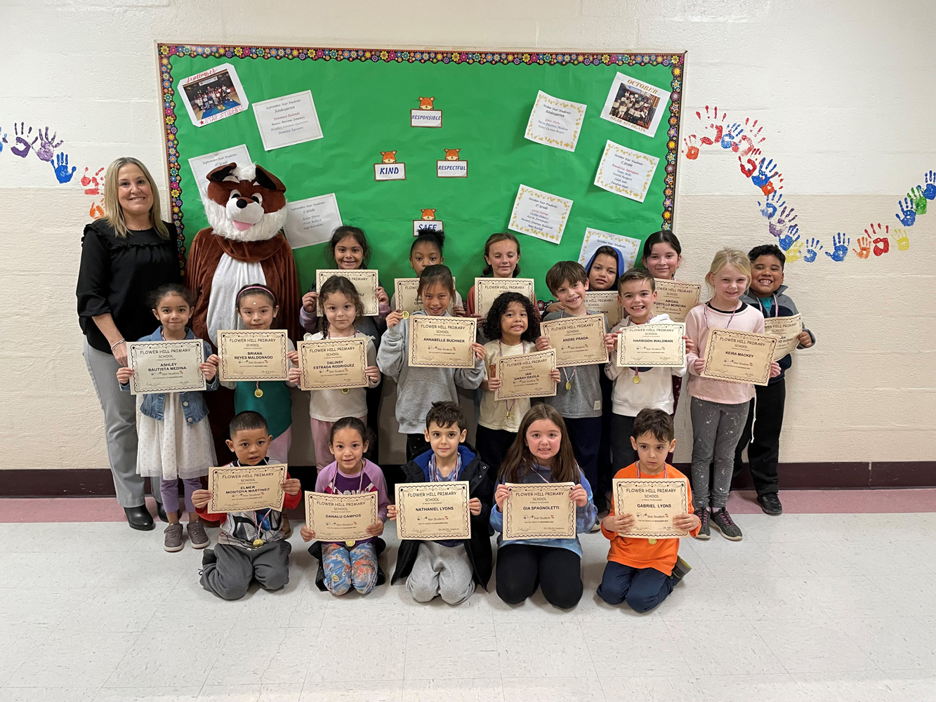  Flower Hill Principal Cindy Siegel with November's Star Student Awards recipients.  