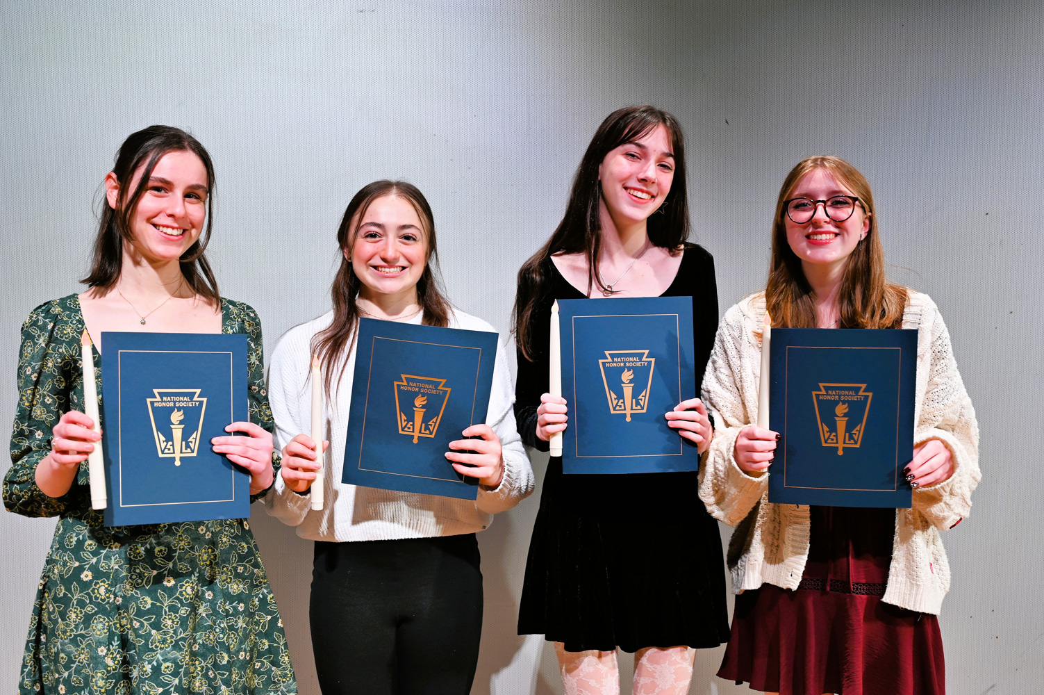  The new National Honor Society members are a very proud group. 