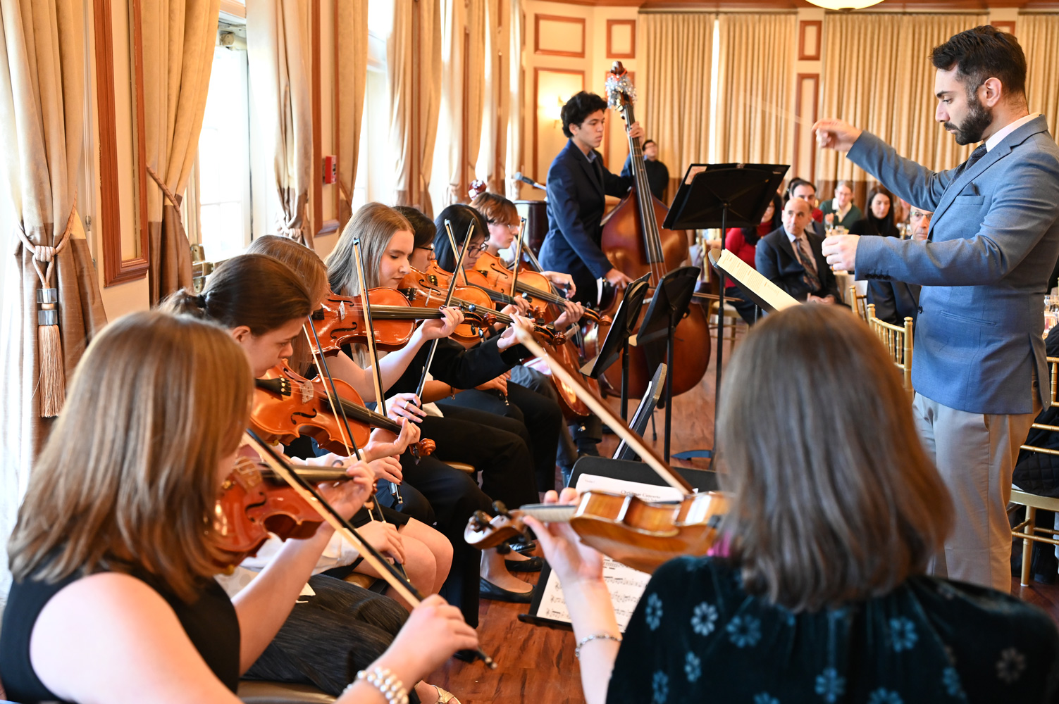 Nine Huntington orchestra members entertained Suffolk school busines officials.