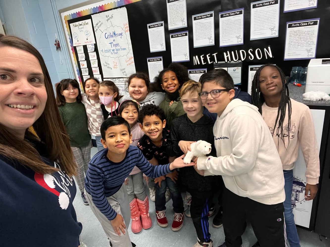  Teacher Katie Kalkau with her third graders and Hudson, the polar bear.  