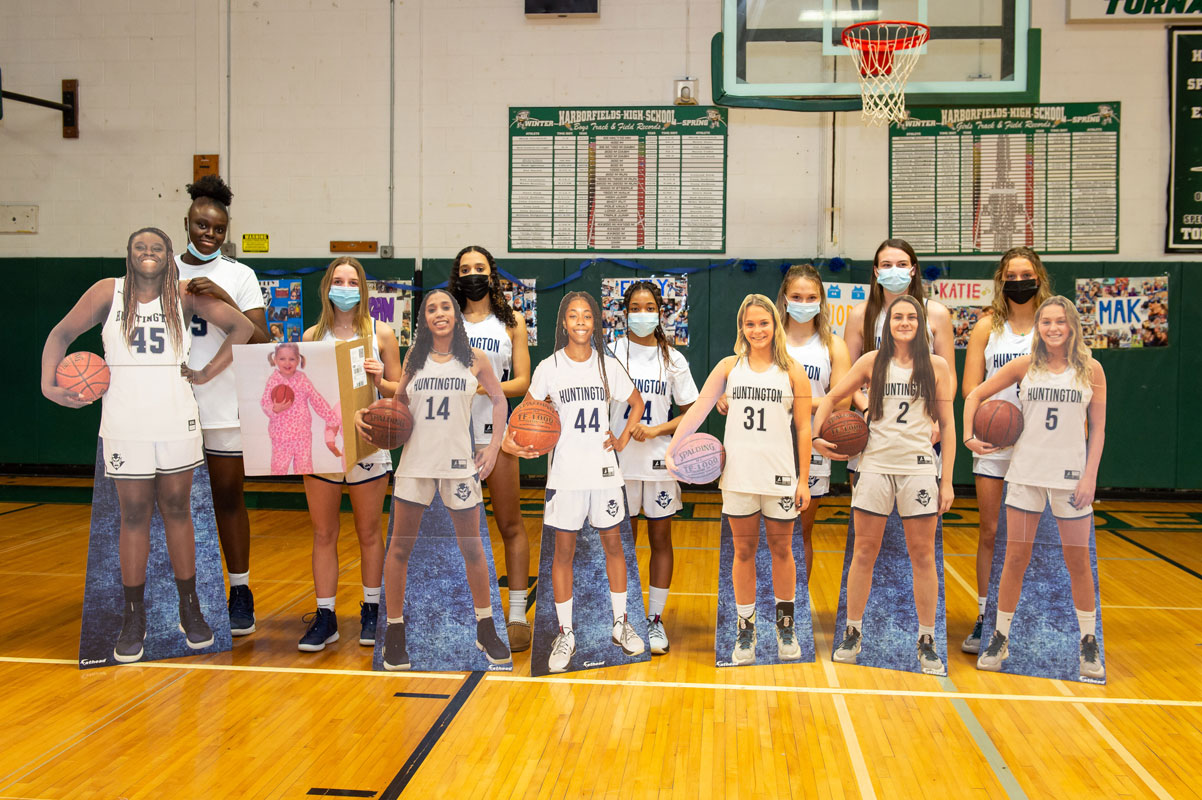 The seniors with large cutouts of each player. (Darin Reed photo.)