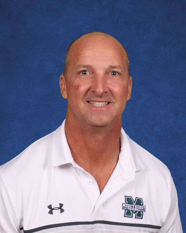  Physical education teacher Christopher Taylor  leads the girls' football intramurals. 