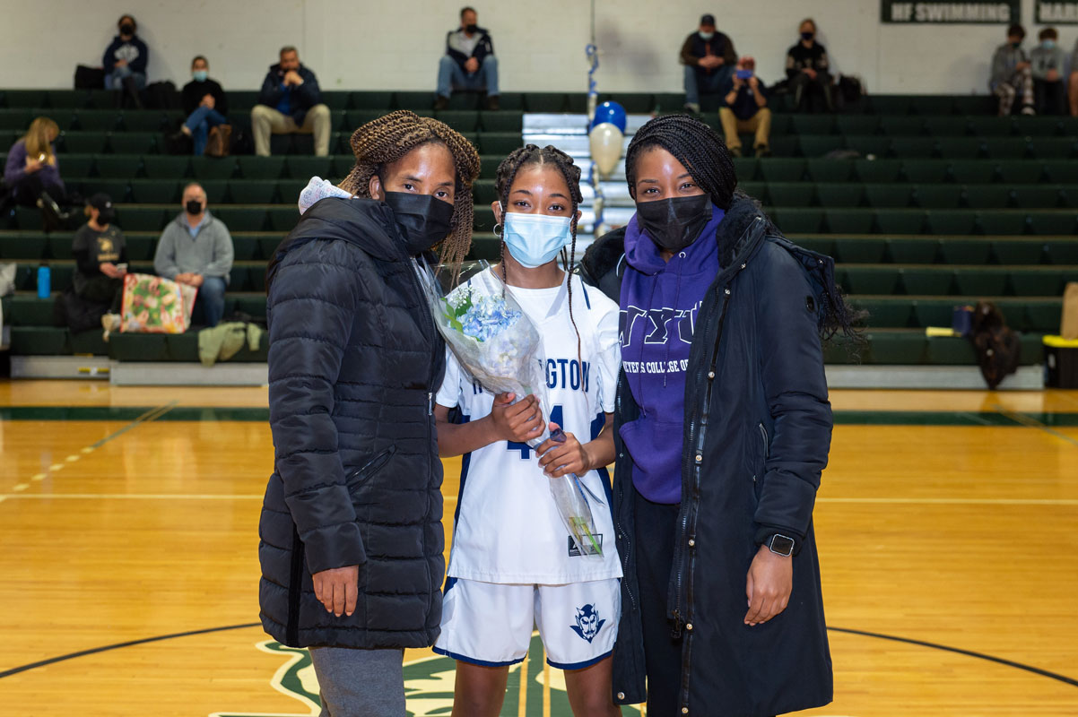 Shaneek Shand with her family on Senior Day. (Darin Reed photo.)