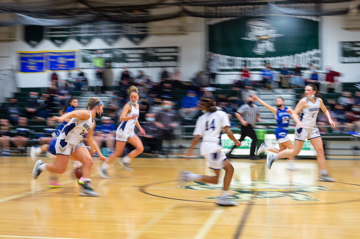 The Huntington girls' basketball team in action against Centereach. (Darin Reed photo.)