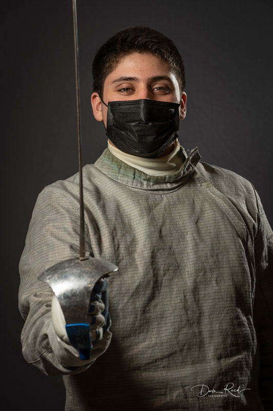 Huntington fencer Omar Cruz Jr. is helping the Blue Devils win this winter.