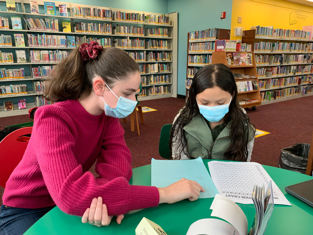 Charlotte Gordon working with a Woodhull fifth grader.