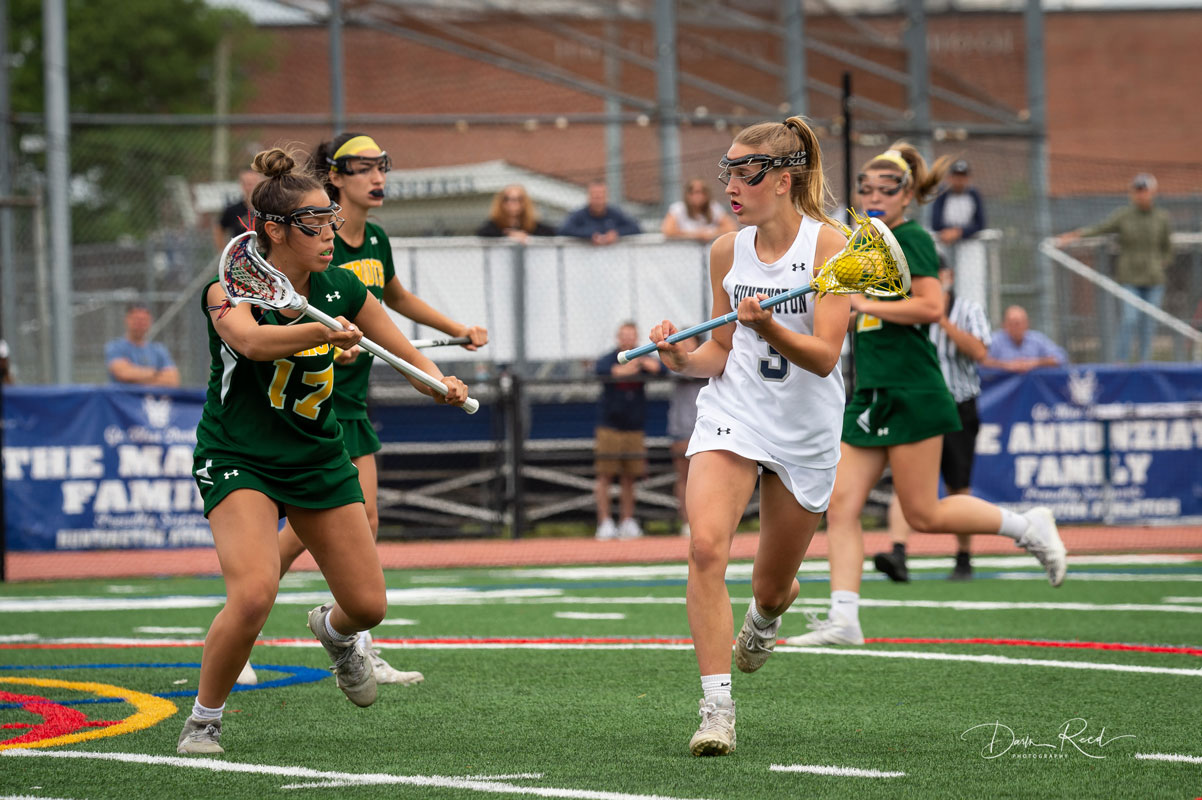 Regan Sansiviero plays keep away with Ward Melville. (Darin Reed photo)