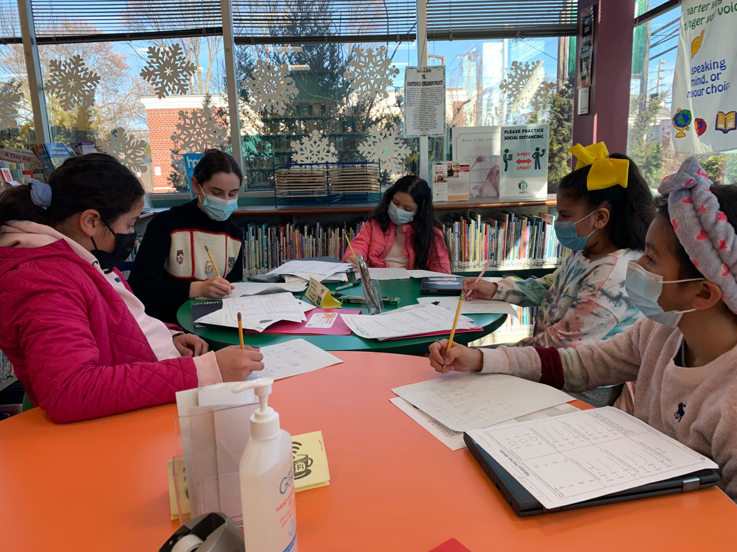 Charlotte Gordon (second from left) volunteers as a tutor.