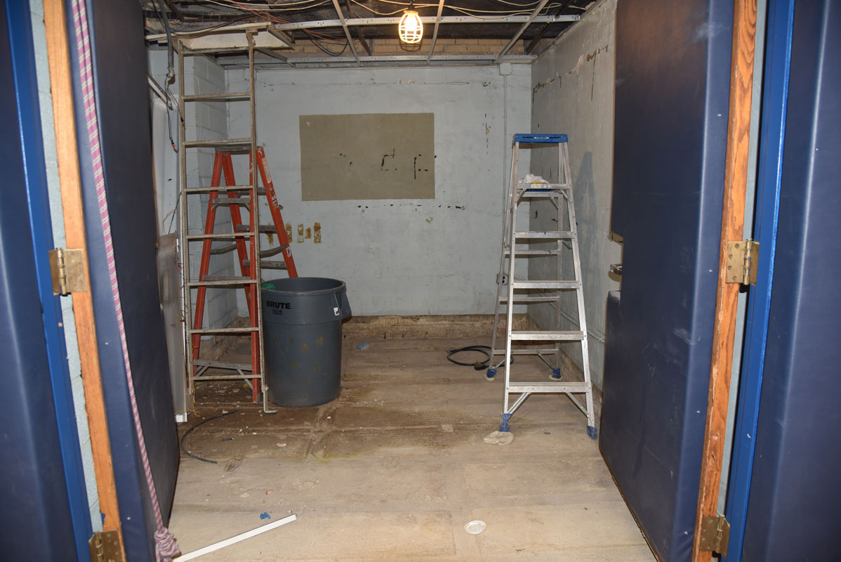 A gym equipment closet that is being repaired.