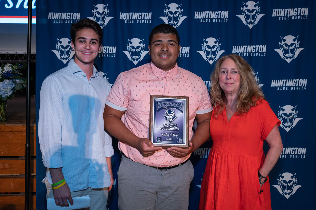 Peter Steen Memorial Scholarship recipient Kaleef Riley with Steen family members. (Darin Reed photo.)