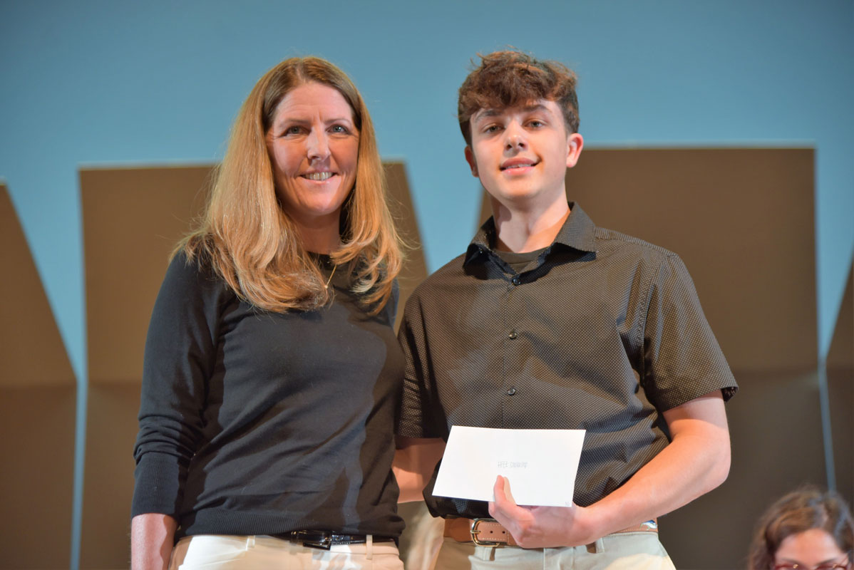 CFO Meghan Knieriem presents the Huntington Foundation scholarship to Nick Smalling 
