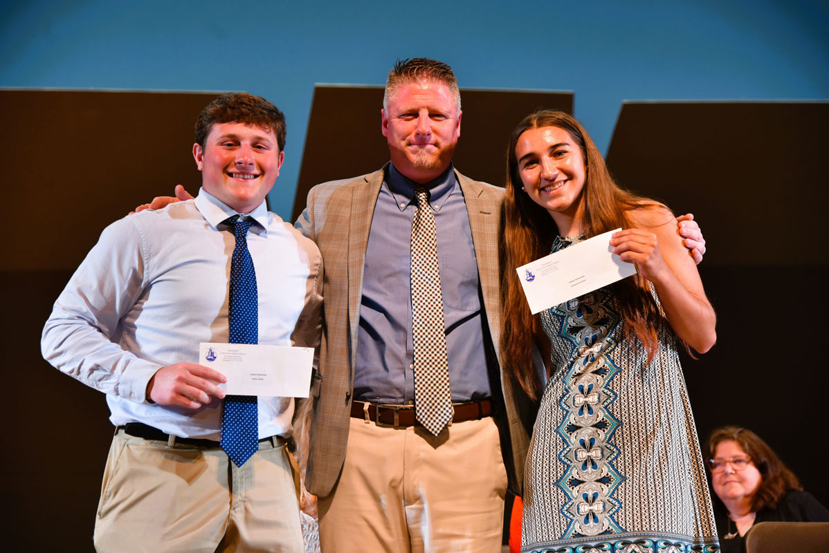 Principal Brenden Cusack with DSPA scholarship recipients Robert Smith and Adrianna LoScalzo 