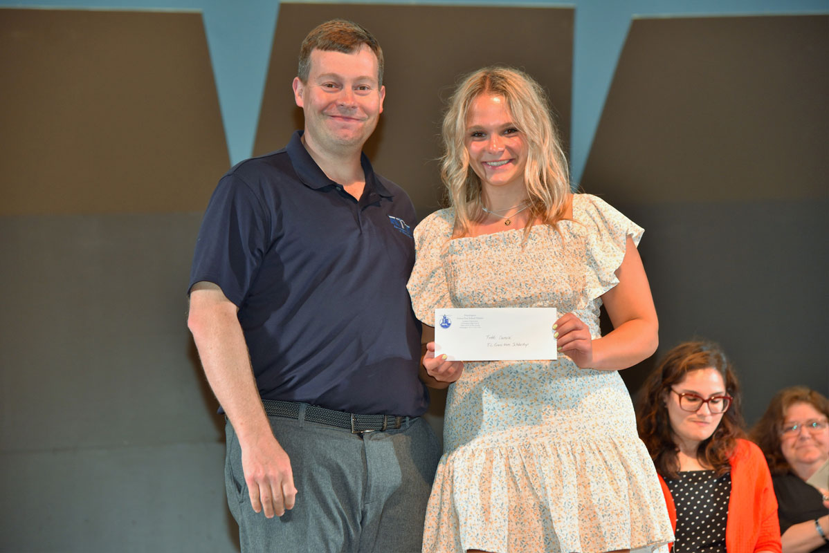 Social studies teacher James Graber with Justin Giani Memorial Scholarship recipient Theadora Carnesi 