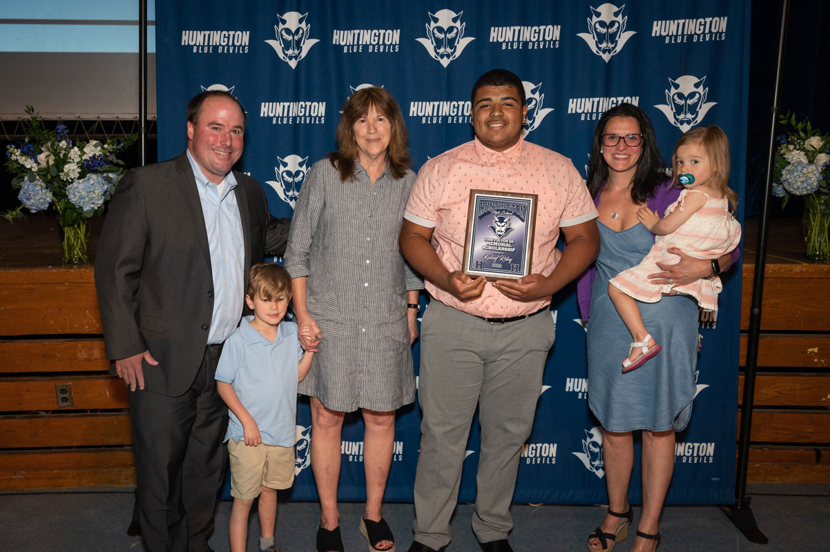 Fulton scholarship recipient Kaleef Riley with the Fulton family. (Darin Reed photo.)
