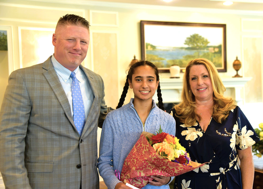 Jasjeet Kaur (center) with Principal Brenden Cusack and PTA Council President Toniann Mangan.  