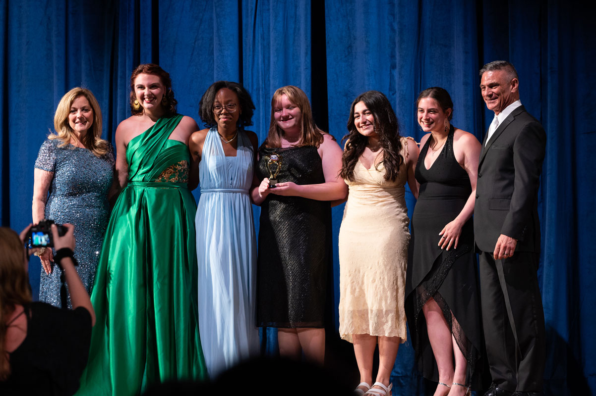Huntington drama club seniors accept the Best Ensemble in a Musical Award. (Darin Reed photo.)