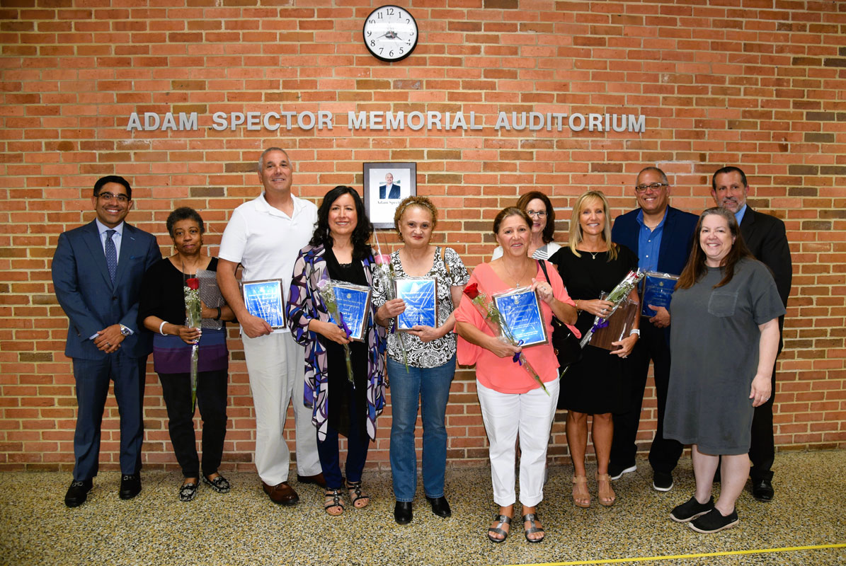 The retirees gathered with Huntington UFSD officials for a commemorative photo
