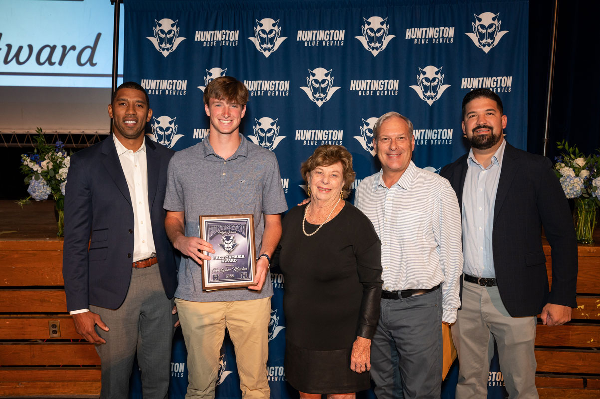 Chris Maichin with the Cambria family and Huntington coaches. (Darin Reed photo.)
