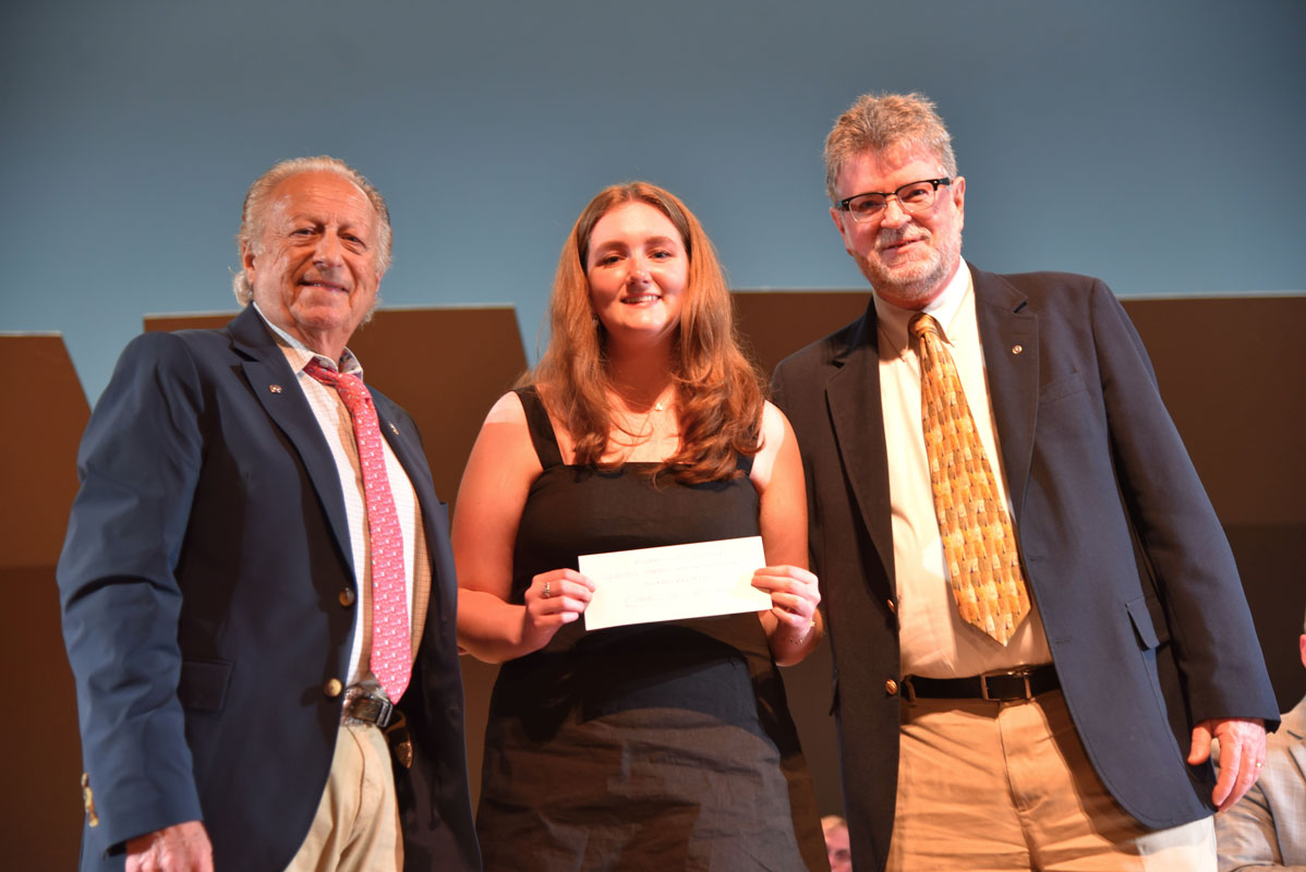Quentin Sammis Award recipient Charlotte Cheshire is flanked by Kiwanis Club officials Peter Macaluso and John Reilly 