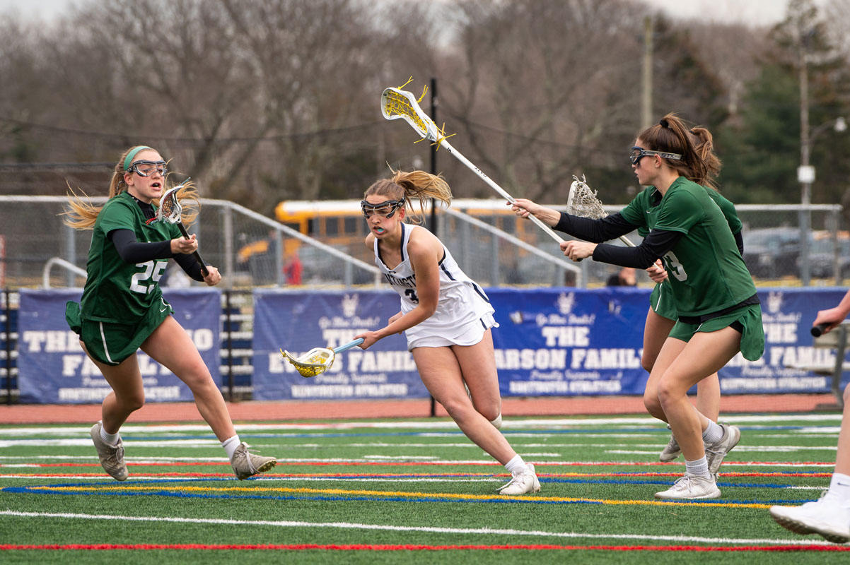 Regan Sansiviero threats a needle. (Darin Reed photo.)