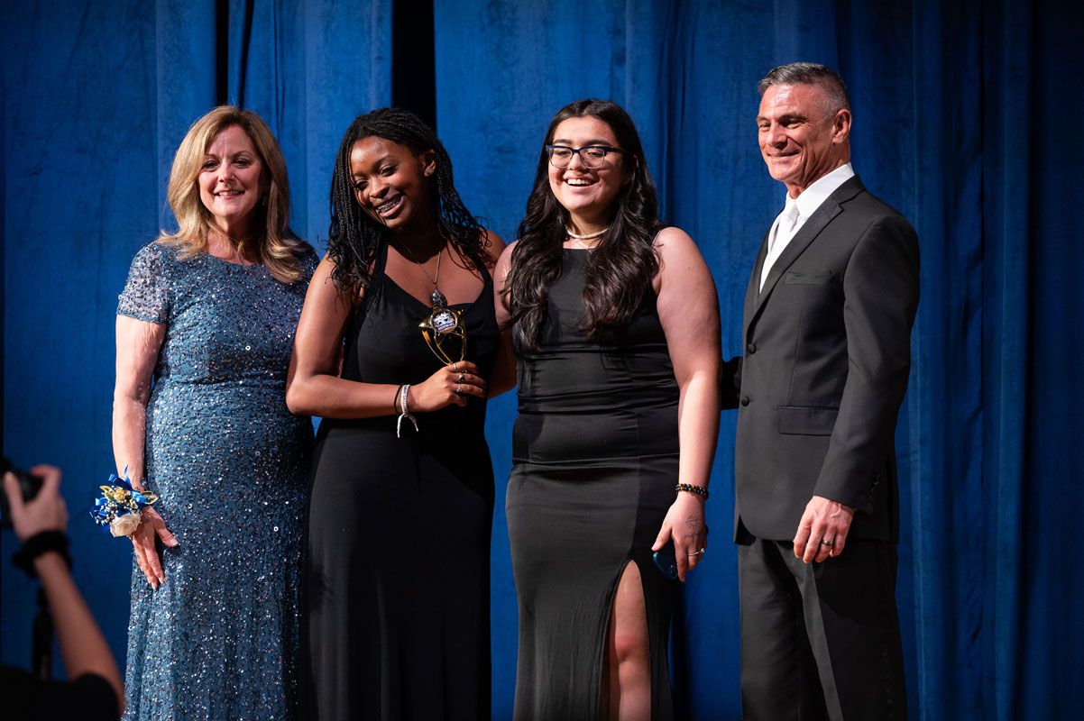 Cianna Batts and Nathali Ulloa accept the Best Stage Set Design Award from Joan Cergol and David Bennardo.