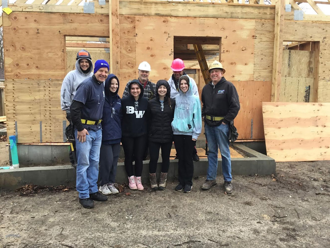 Faculty advisor Robert Gilmor III with Huntington Habitat members.  