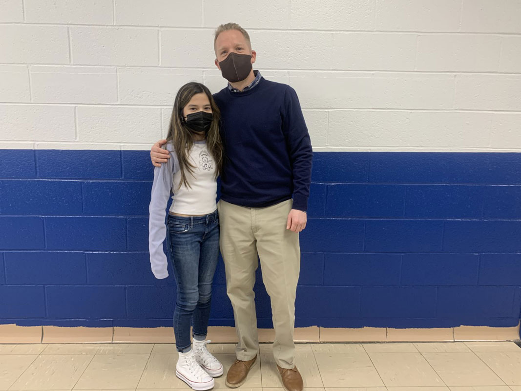 PTA Reflections contest honoree Nicole Orrego Salinas with Principal Scott Oshrin.