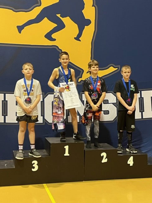 Jason Bencivenga atop the state victory stand.