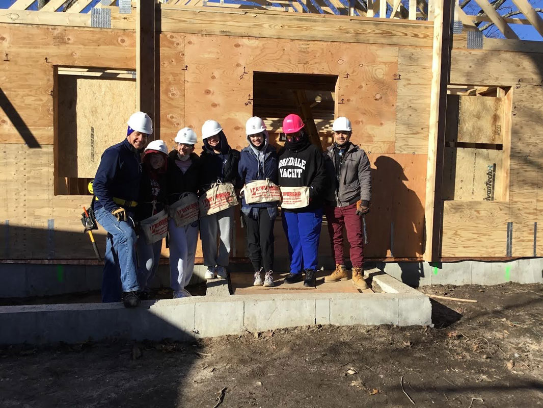 Faculty advisor Robert Gilmor III with Huntington Habitat members.  