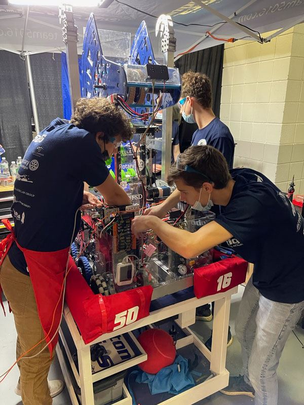 Huntington Robotics team members at work on their robot.