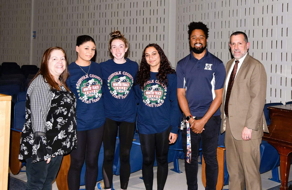 Huntington's All-State girls' track athletes with Coach Mark Jackson, Supt. Jim Polansky and BOE President Christine Biernacki.